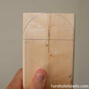 Marking the cornhole table legs.