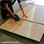 Cutting plywood with a circular saw.